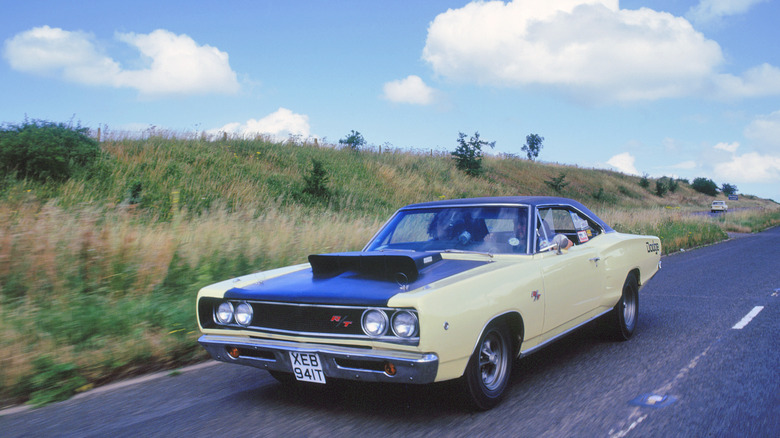 1969 Dodge Coronet R/T driving on European road, front-left 3/4 view