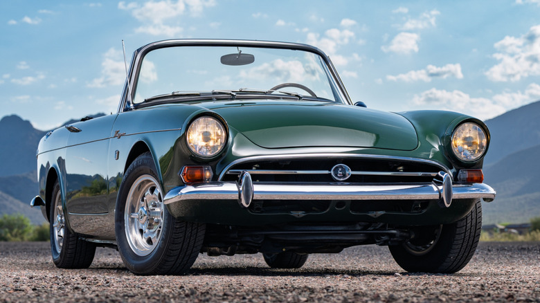 Front 3/4 view of Sunbeam Tiger parked on gravel in mountainous setting