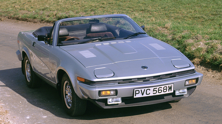 Front 3/4 view of Triumph TR8 Roadster parked on roadway