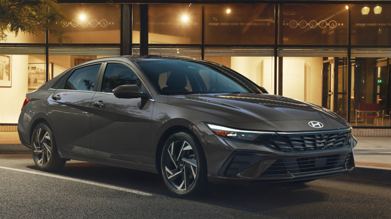 Front 3/4 view of Hyundai Elantra in urban setting