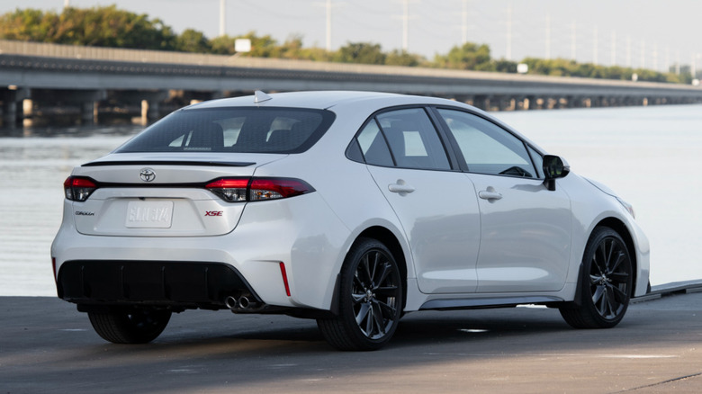 Rear 3/4 view of Toyota Corolla in seaside setting
