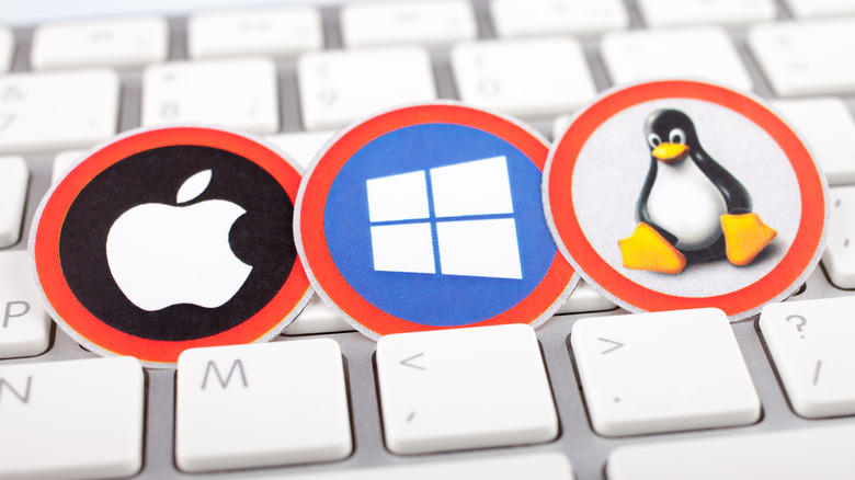 Windows, Mac OS, and Linux logo on a keyboard