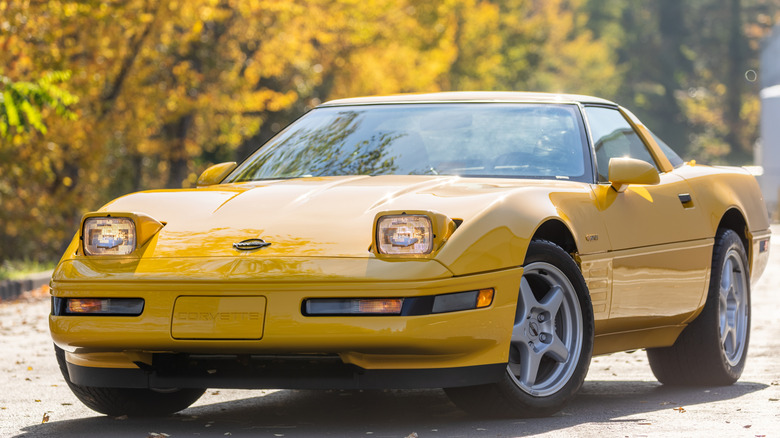 Yellow C4 Corvette ZR-1 with headlights popped up