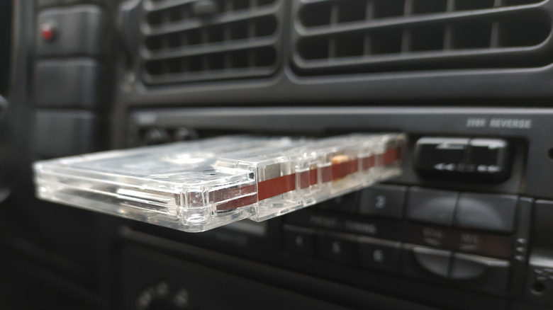 Cassette tape resting in car stereo