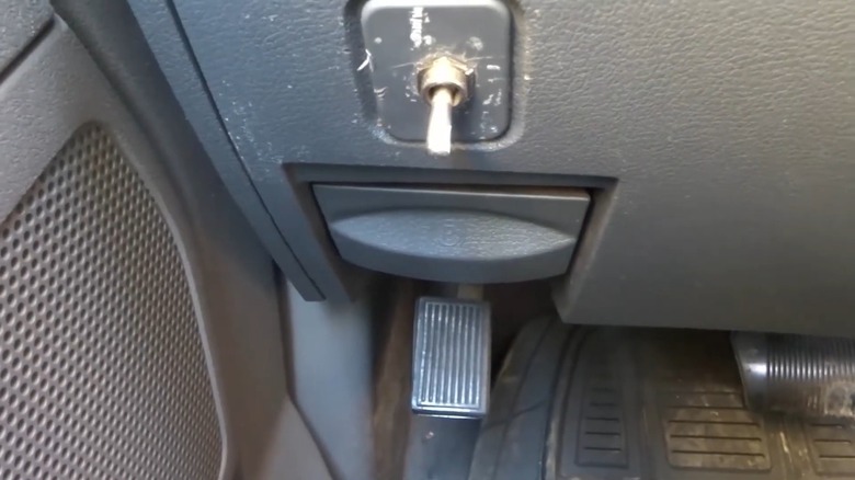 Close-up of foot-operated parking brake taken from driver's seat
