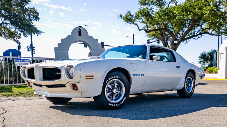 A white 1973 Pontiac Firebird Trans Am parked
