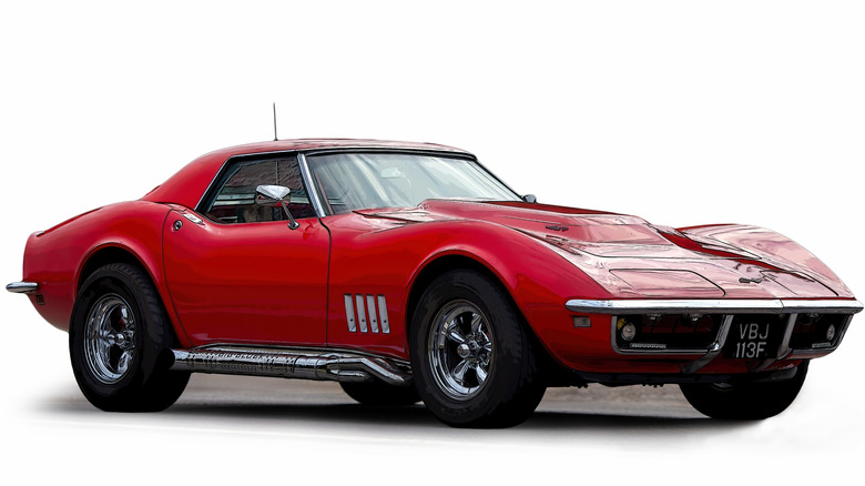 Red Chevrolet Corvette Sting Ray on plain background