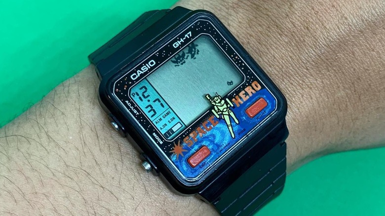 A Casio Space Hero video game watch worn on a person's wrist