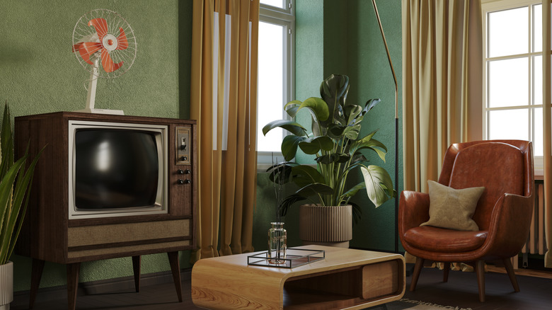 A retro living room with 1970s-era electronics and furniture
