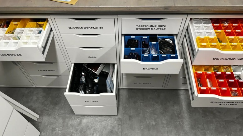 Many Alex & Malm office cabinets with 3D printed drawer inserts.