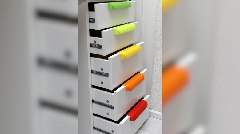 3D printed handles attached to Ikea Alex drawers.