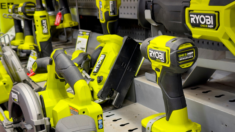 A variety of Ryobi tools displayed on store shelves