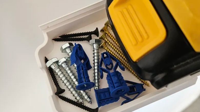A 3D printed hardware drawer connected to a DeWalt battery.