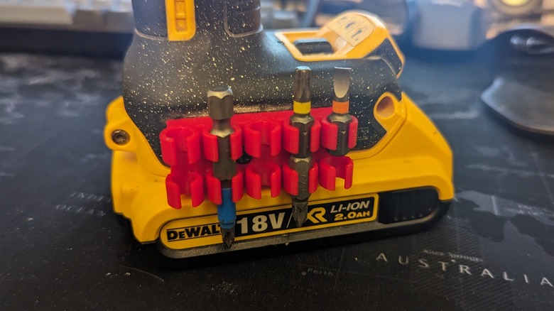 A 3D printed bit holder on a DeWalt drill.