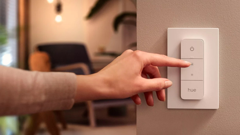 A photo of the Philips Hue Smart Wireless Dimmer Switch installed on a wall.