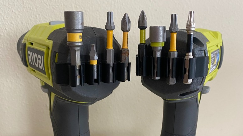 A 3D printed Ryobi drill bit holder on two drills.