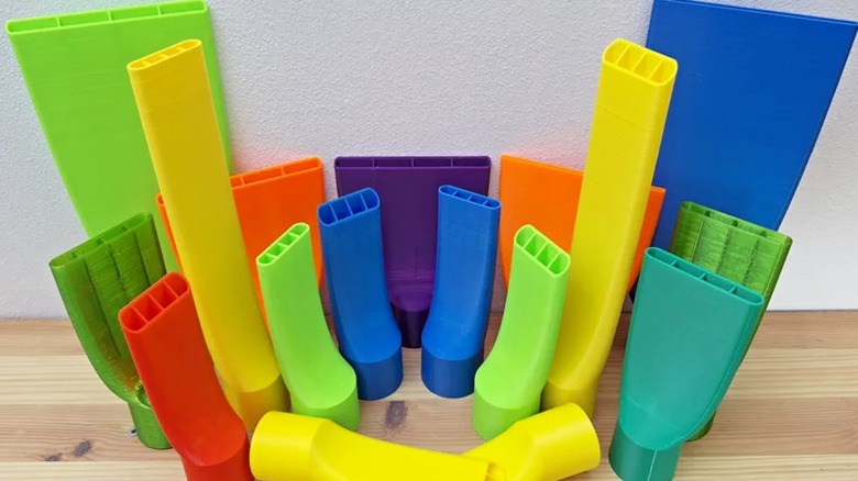 3D printed vacuum nozzles on a table.