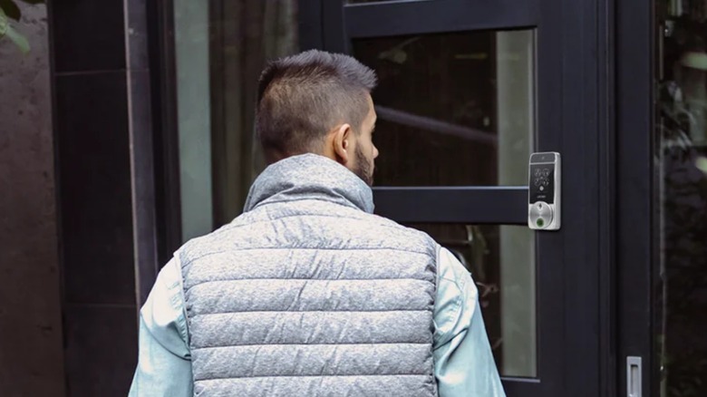 Man looking at Lockely Visage Zeno Series Smart Lock on door