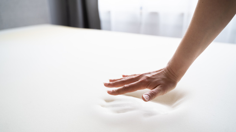 hand pressing memory foam