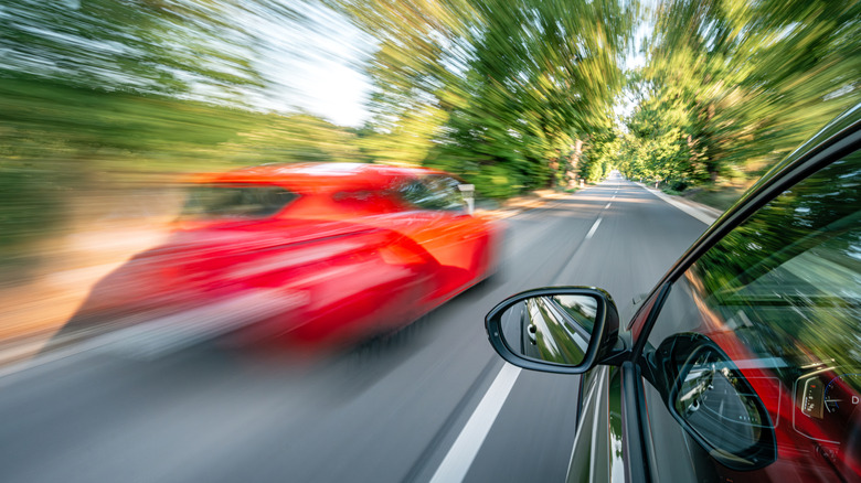 cars on road speeding along
