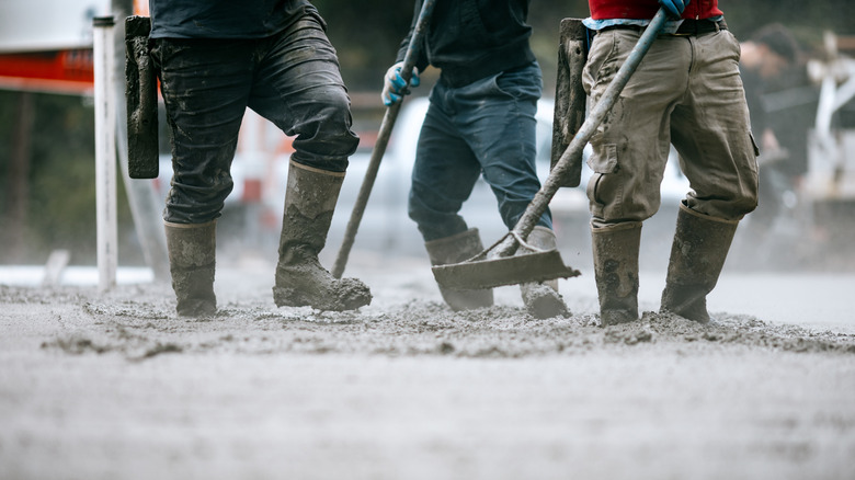 Work people laying concrete.