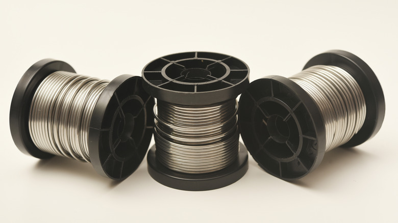 Coils of solder on a white background