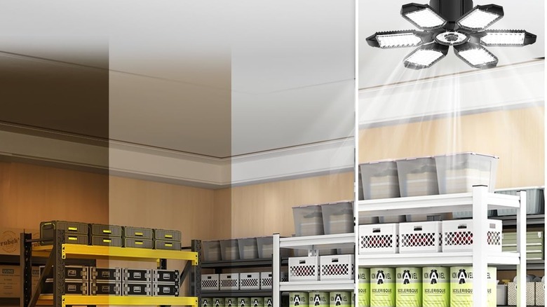 A garage light shining down on some boxes.