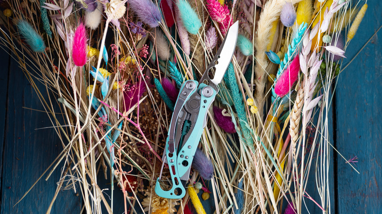 Pocket knife on top of flowers