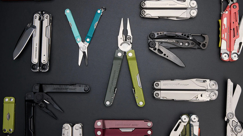 Variety of colorful Leatherman tools on grey background
