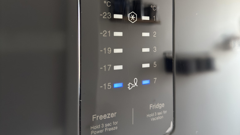 Digital temperature control panel on a Samsung refrigerator door.