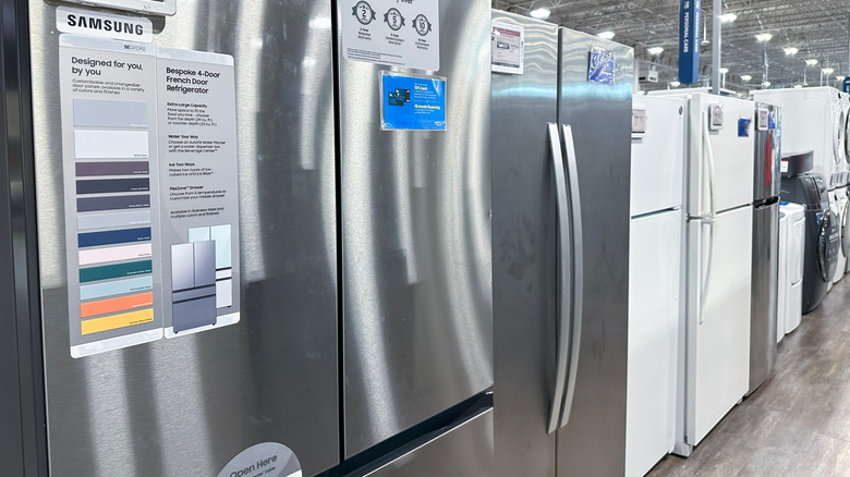 Showroom display of a stainless steel Samsung Bespoke 4-Door French Door Refrigerator.