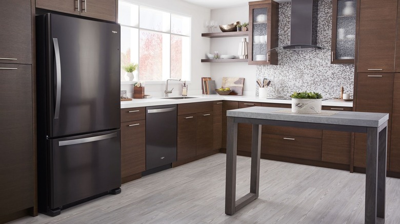 Black Whirlpool refrigerator in a kitchen
