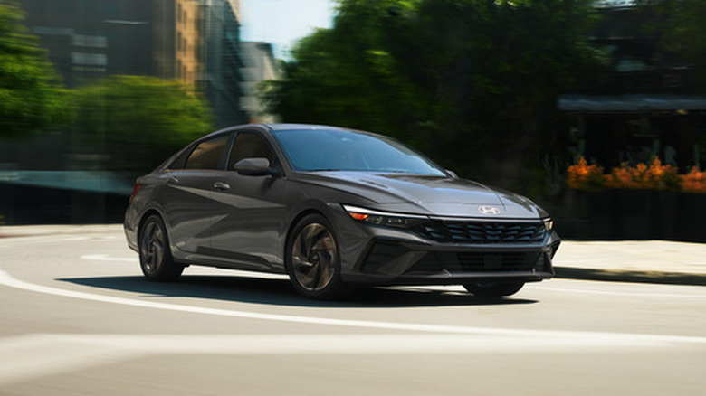 A 2026 Hyundai Elantra Hybrid driving on a city street