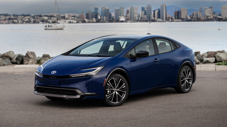 A 2026 Toyota Prius parked next to a lake