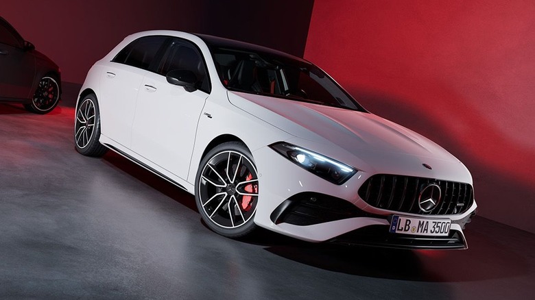 2026 Mercedes-Benz A45 AMG on red background, front-right 3/4 view
