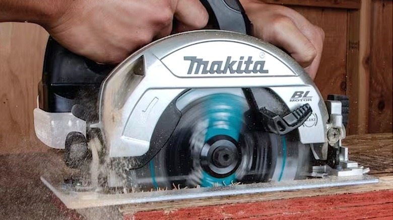 Person using Makita Compact Circular Saw