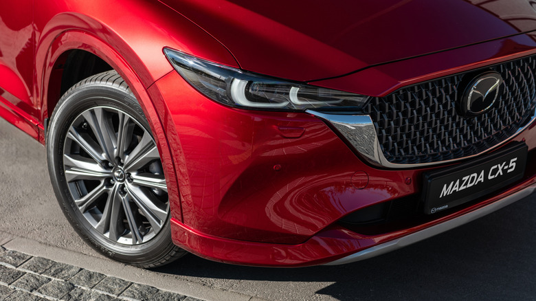 A close-up of a red 2025 Mazda CX-5 parked.