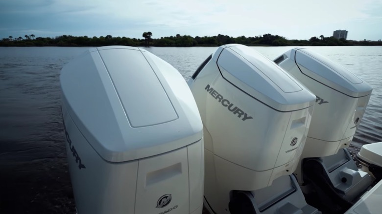 Mercury units installed on a boat on the water.
