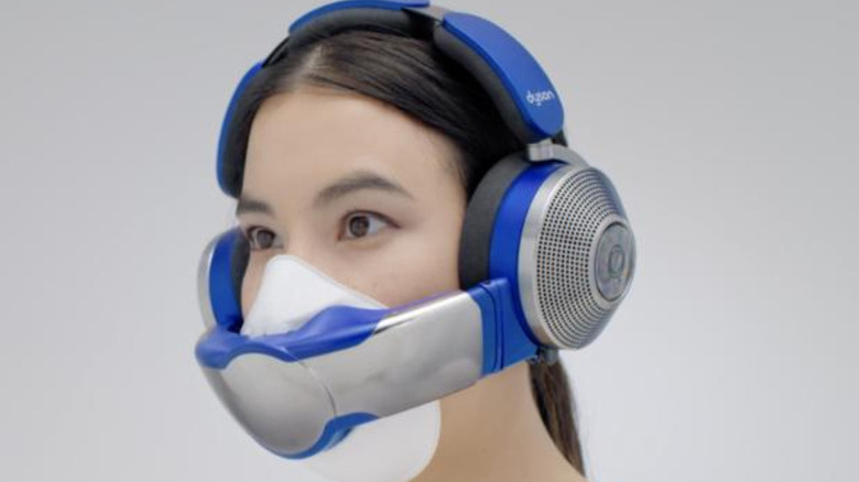 A person wearing a Dyson Zone headphone with face visor