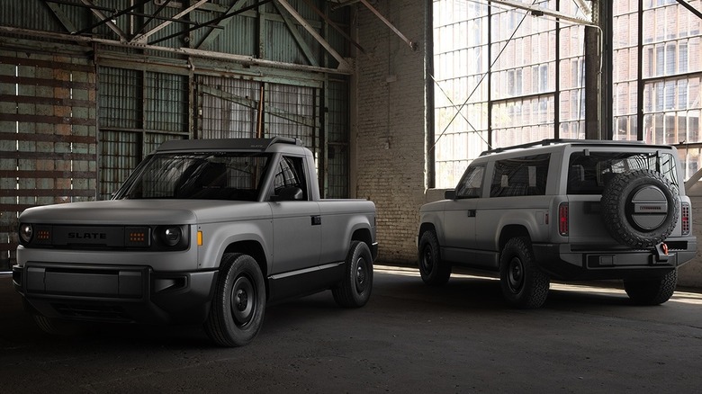 A Slate pickup and SUV parked inside a warehouse