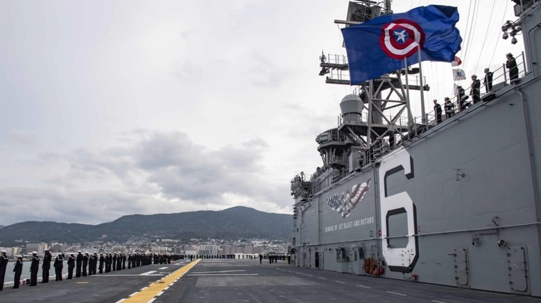 Sailors standing on the deck of USS America.
