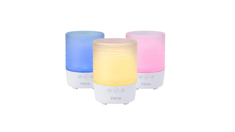 A studio shot of three iHome Portable Bluetooth Candle Speakers on a white background.