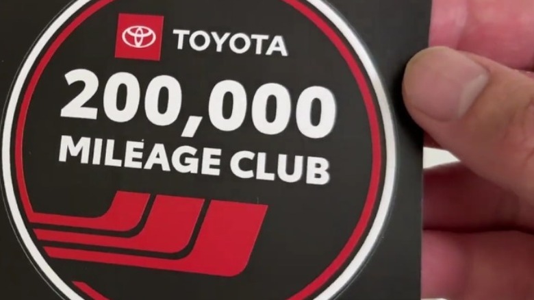A Toyota 200,000 Mileage Club sticker.