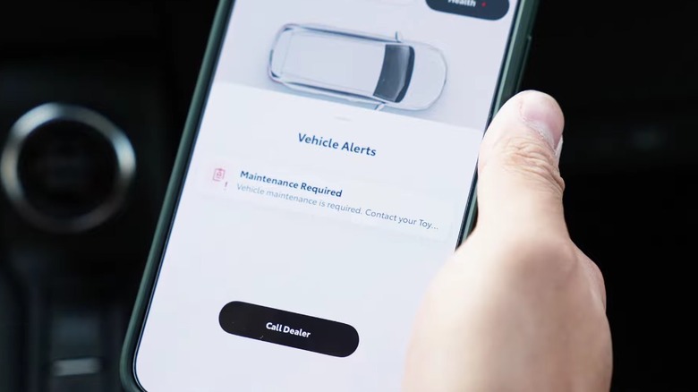 A Toyota vehicle maintenance alert on a smartphone.