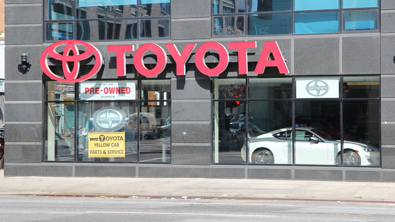 The entrance to a Toyota showroom viewed from the outside.
