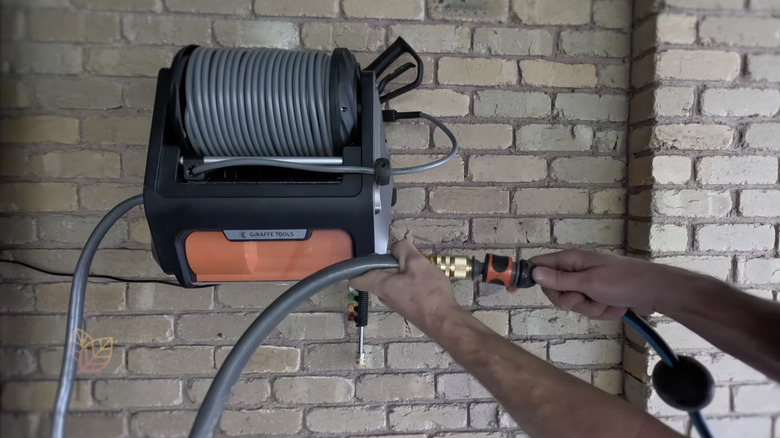 retractable pressure washer on wall