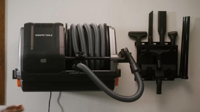 wall mounted retractable vacuum cleaner