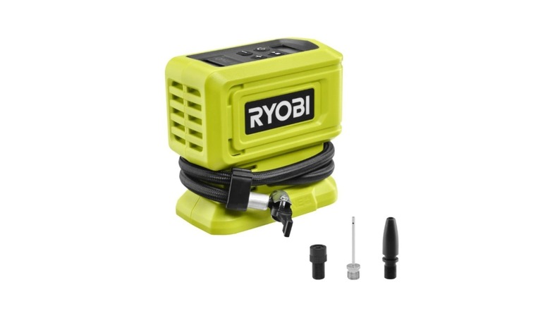 Green and black Ryobi brand digital tire inflator with attachments on white background
