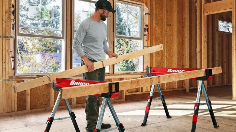 Person setting 2x4s in Bauer Steel Sawhorse