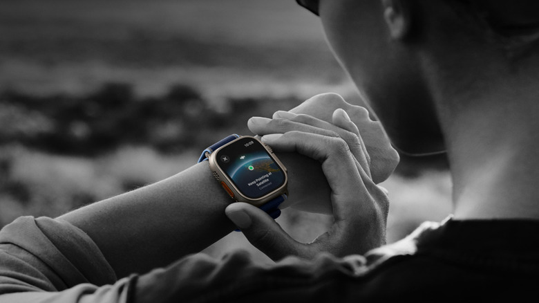 A person checking message on Apple Watch Ultra 3.